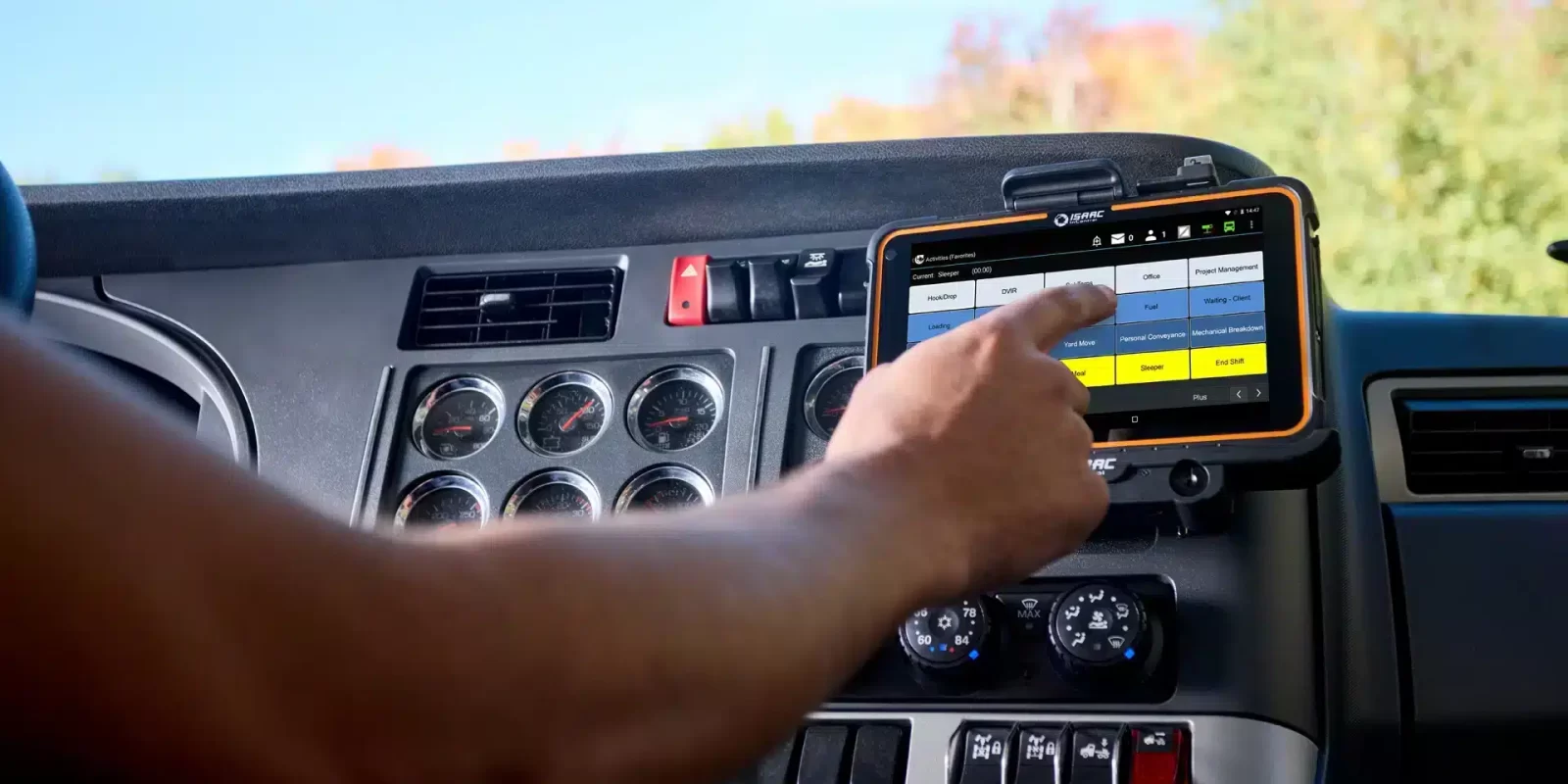 Trappers Transport truck driver using the ISAAC tablet-based workflow platform to connect to the transportation logistics system.