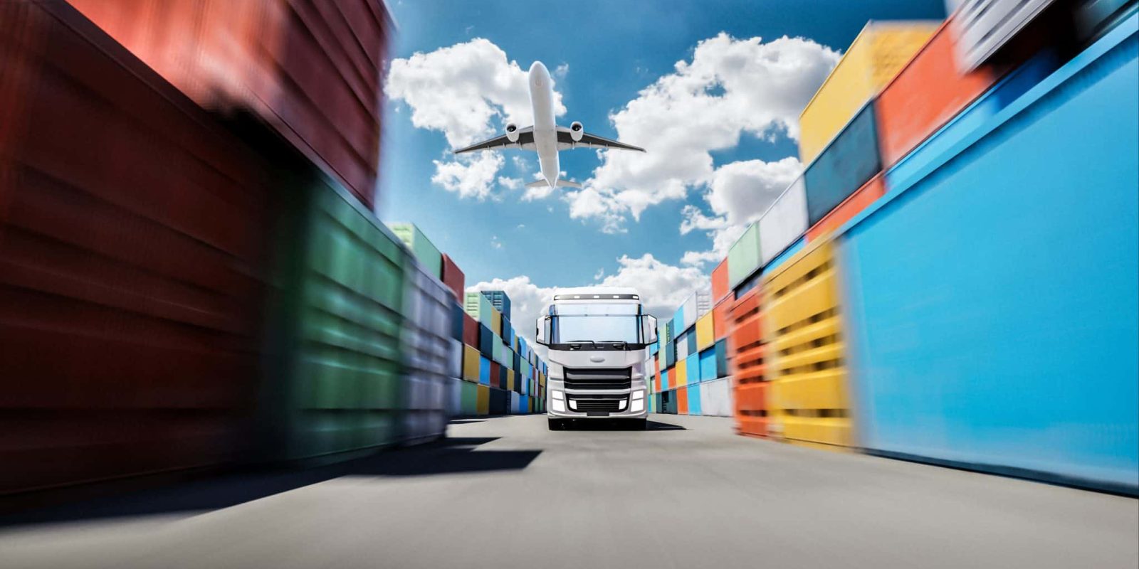 Colorful shipping containers stacked high under a bright blue sky, a freight truck moving with high speed with a cargo airplane overhead. The image clearly suggests themes of international trade, trade wars, transatlantic commerce, and global logistics.