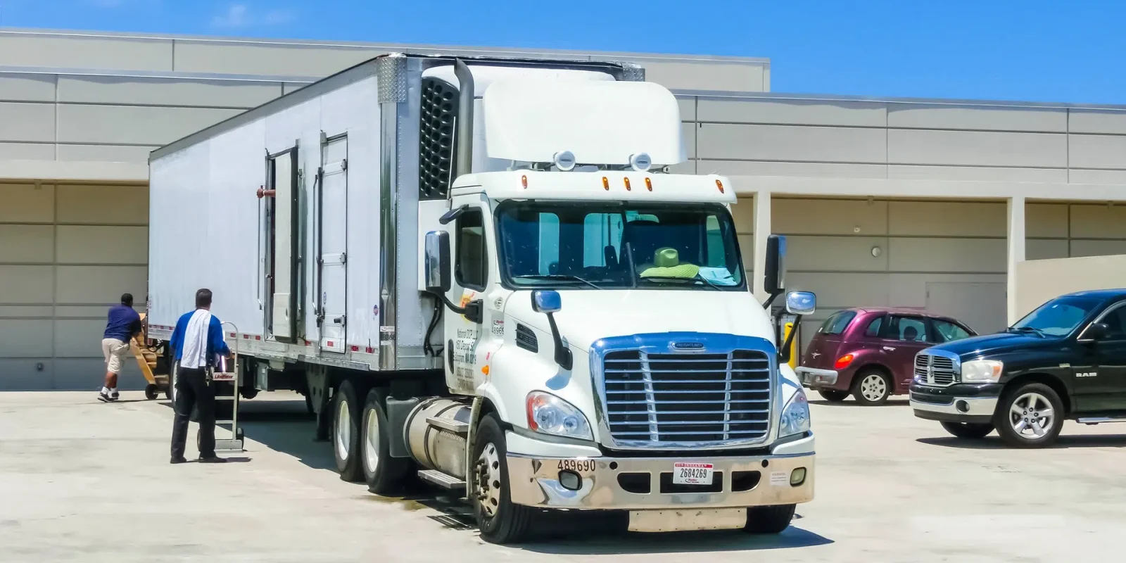 cold-storage-warehousing-service-truck-unloading A temperature-controlled truck unloading at a cold storage warehousing facility.