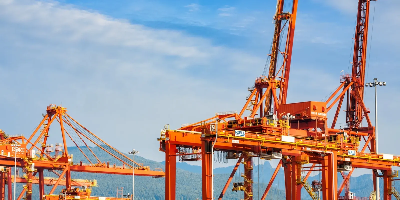 A series of heavy duty cranes at the Trappers Transport dockyard in the Port of Vancouver.